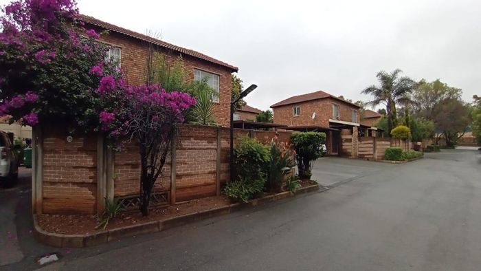 For Sale: Townhouse in Allen's Nek with double carport, security, and communal gardens.