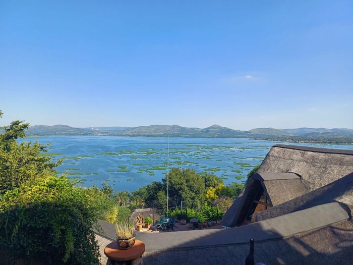 For Sale: House in Kosmos with 2 en suite bedrooms, cottage, and lake views.