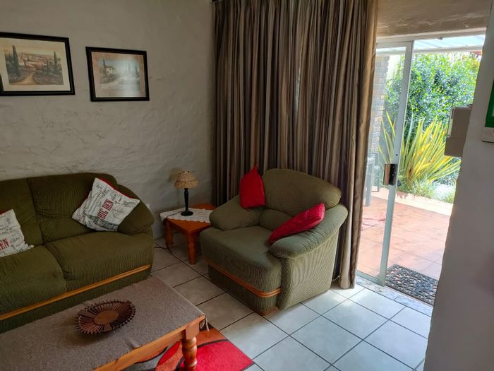 Two-bedroom flat to rent in Kriel Central with private garden and carport.