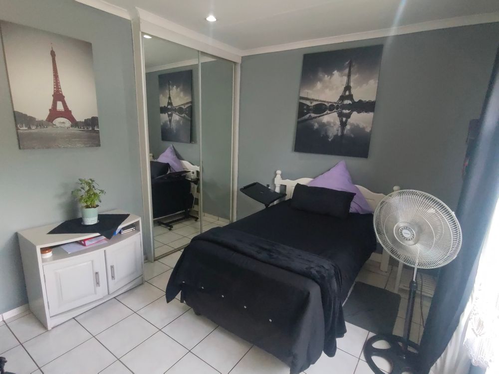 Bedroom with mirror on Build in Cupboards
