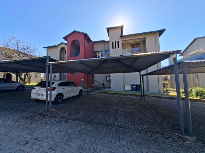 For Sale: Apartment in Homes Haven with balcony, pool, and double carport.