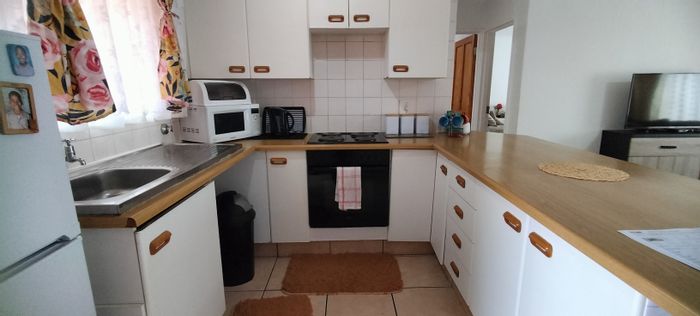 For Sale: 2-Bedroom Apartment in Helderkruin with Pool, Garden, and Secure Parking.