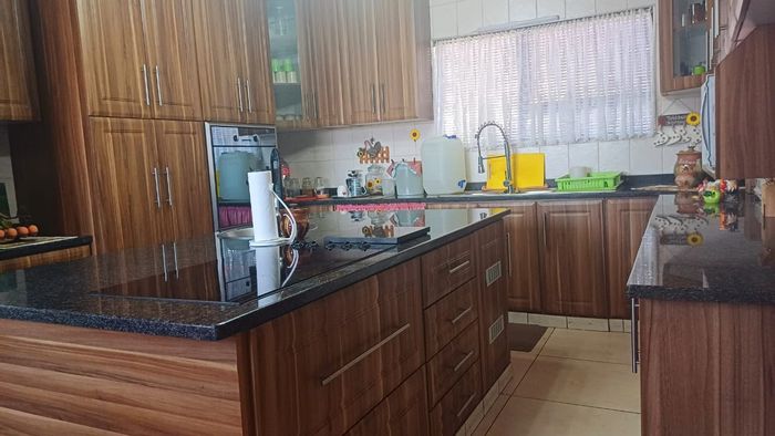 Spacious 4-bedroom house in Evander with ample land and secure parking. For Sale.