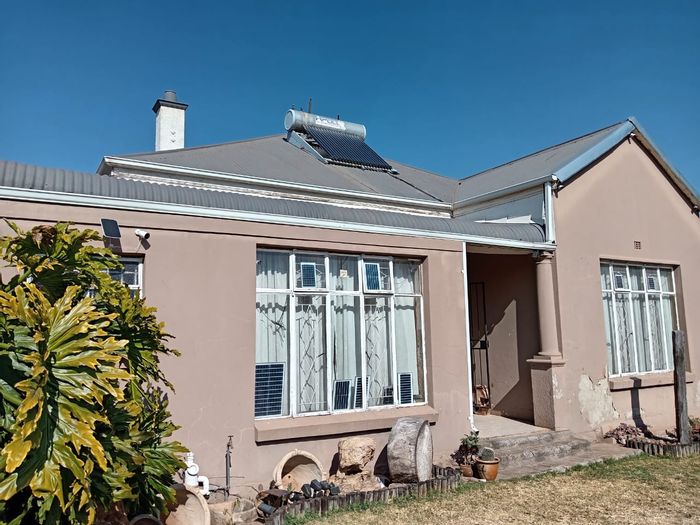 For Sale: 4-Bedroom House in Roodepoort North with spacious yard and secure parking.