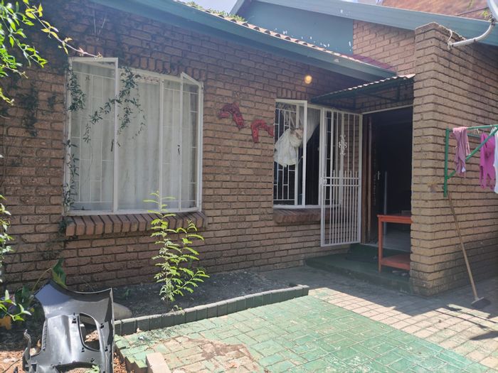 2-Bedroom Apartment For Sale in Rustenburg Central with secure living and ample amenities.