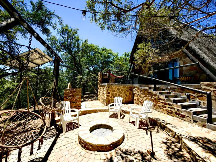 House for Sale in Utopia Nature Estate: Indoor-outdoor living, hiking trails, and riverfront camping.