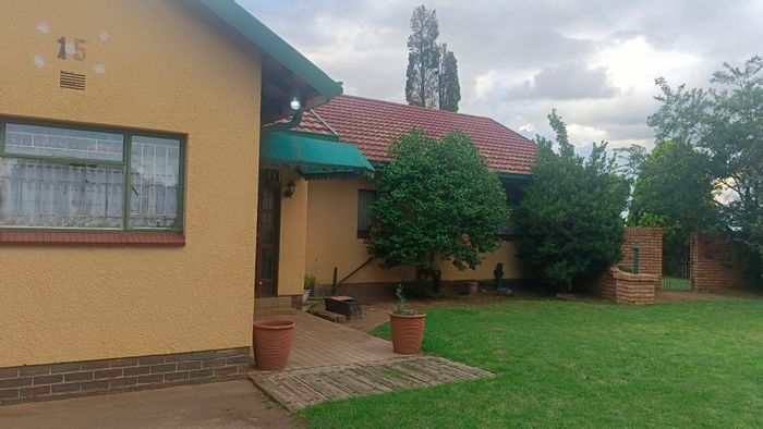 4-Bedroom House For Sale in Kriel Central with outdoor braai and security features.
