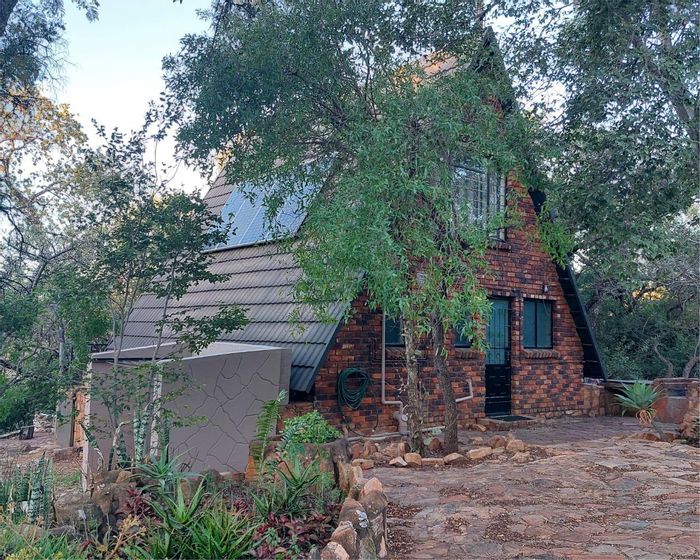 For Sale: House in Utopia Nature Estate with pool, tennis court, and hiking trails.