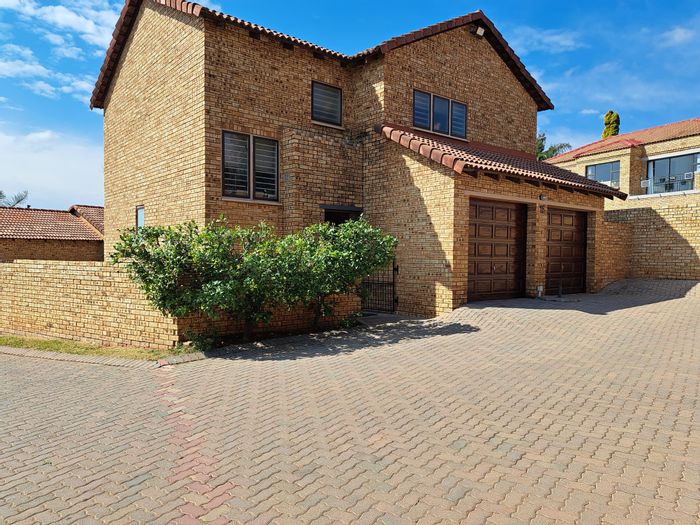 For Sale: 4-Bedroom Townhouse in Ruimsig with patio, braai, and ample parking.