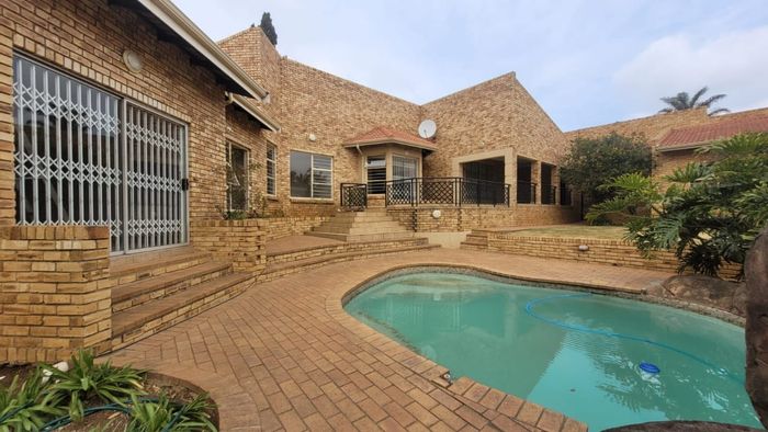 Spacious 6-bedroom house with pool, flatlet, and ample parking in Noordheuwel. To Rent.
