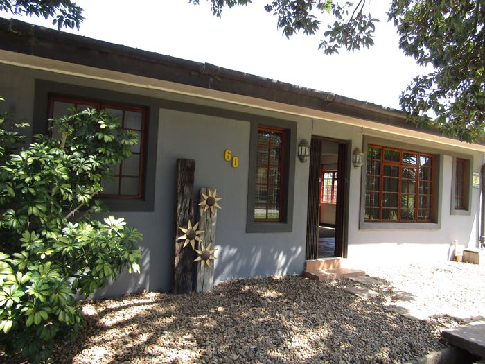 For Sale: Spacious Humansdorp Central house with garden cottage, garages, and home office.