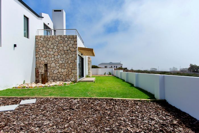 House For Sale in Steenbergs Cove: 3 Bedrooms, sea views, garden, solar system.