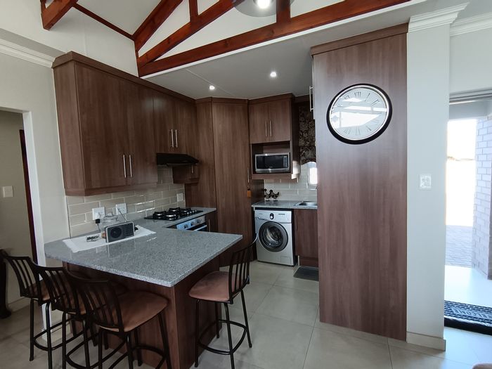 Kruinpark House For Sale: 2 beds, garage, solar panels, secure complex amenities.