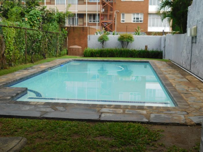 Queenswood Townhouse For Sale: 2 beds, garage, pool access, near shopping and schools.