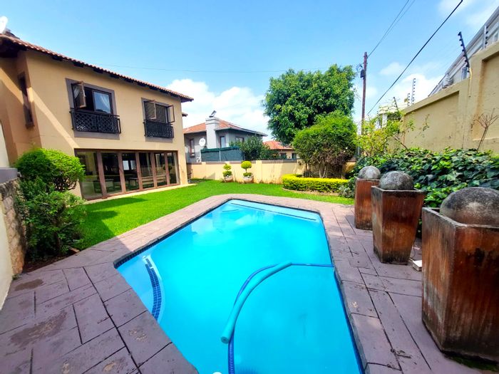 For Sale: Townhouse in Monument Park with pool, garden, and spacious living areas.