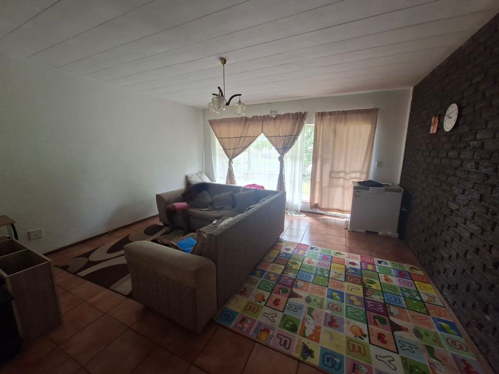 Door leading to patio overlooking communal garden