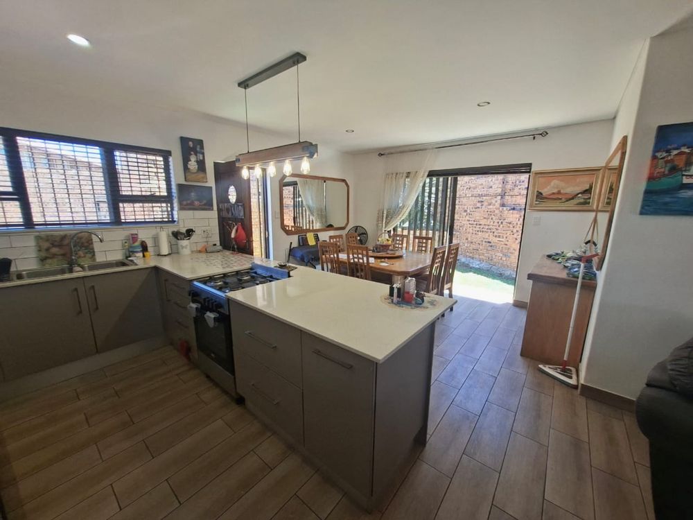 Kitchen and dining room with slider to garden