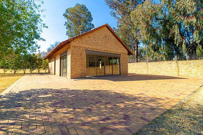 Vaalview House For Sale: River Lodge with braai area, pool, and boat locker.