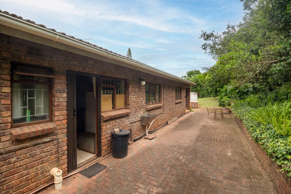 Back of house. At far end of building is the entrance to the outside bedroom