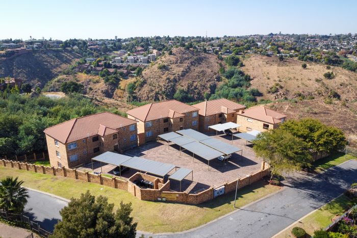 For Sale: Rangeview Apartment with 3 Bedrooms, Balcony, Built-in Braai, 2 Parking.