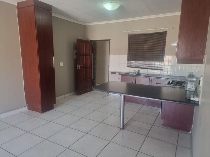 For Sale: Secunda Central Townhouse with balcony, built-in braai, and 24/7 security.
