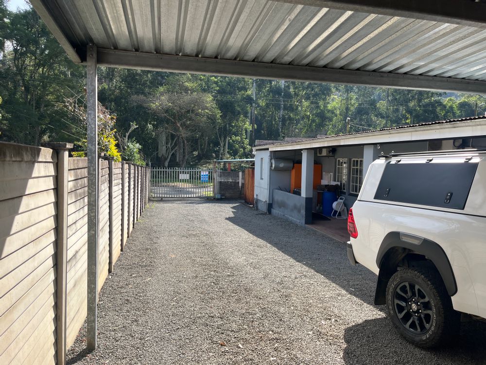 Looking from the garage down the driveway of the 'Office house'. The offices on the right.