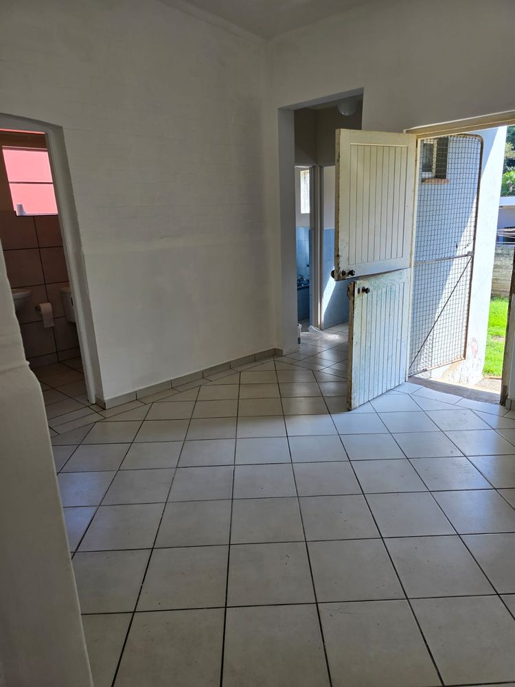 2 bathrooms off the dining area. Back door .