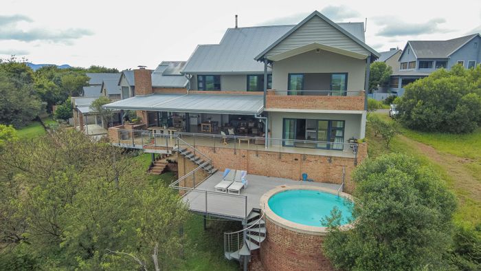 For Sale: House in The Coves with 5 bedrooms, pool, and private jetty access.