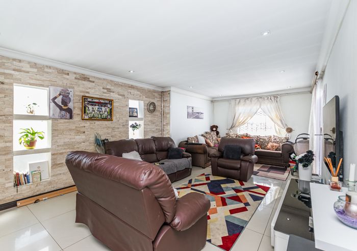 3-Bedroom House For Sale in Cosmo City with carport and paved yard.