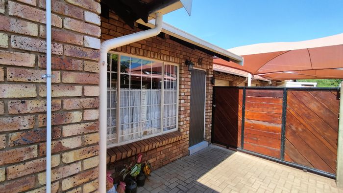 3-Bedroom Townhouse For Sale in Dorandia with garden, garages, and eco-friendly features.