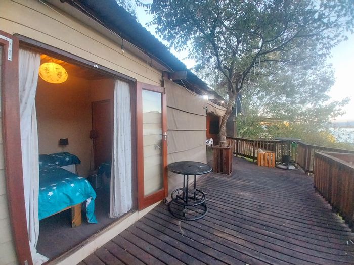 Worcester Rural House For Sale: Cabin with deck, water views, and resort amenities.