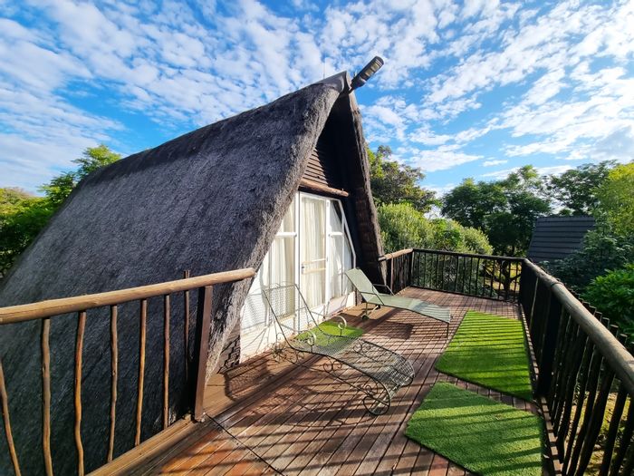Charming house in Utopia Nature Estate with communal pools, tennis, and hiking trails. For Sale.
