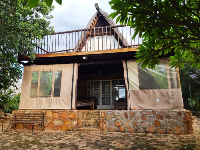 Charming house in Utopia Nature Estate with communal pools, tennis, and hiking trails. For Sale.