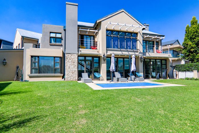 For Sale: House in Copperleaf Estate with pool, golf views, and solar power.