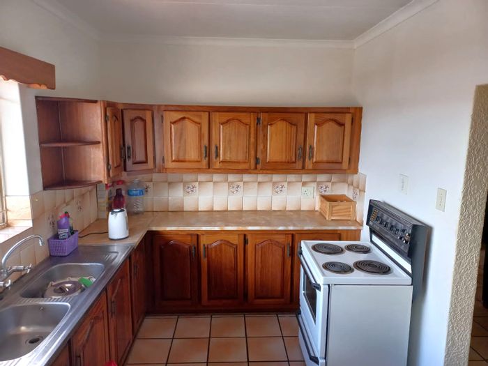 2-Bedroom Apartment For Sale in Potchefstroom Central with secure parking and amenities.