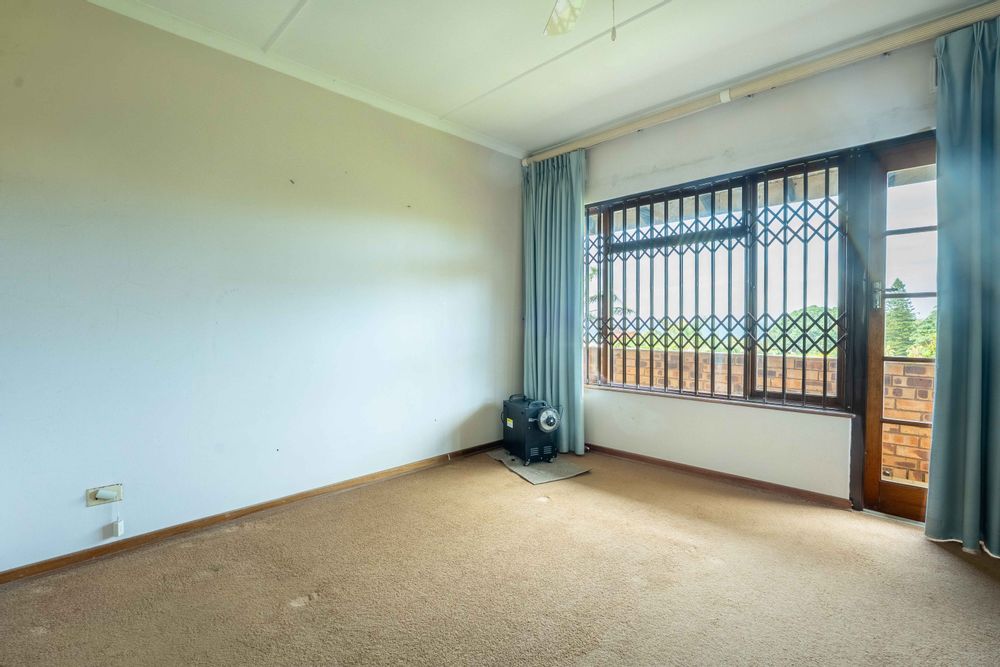 Main bedroom with own balcony overlooking ocean