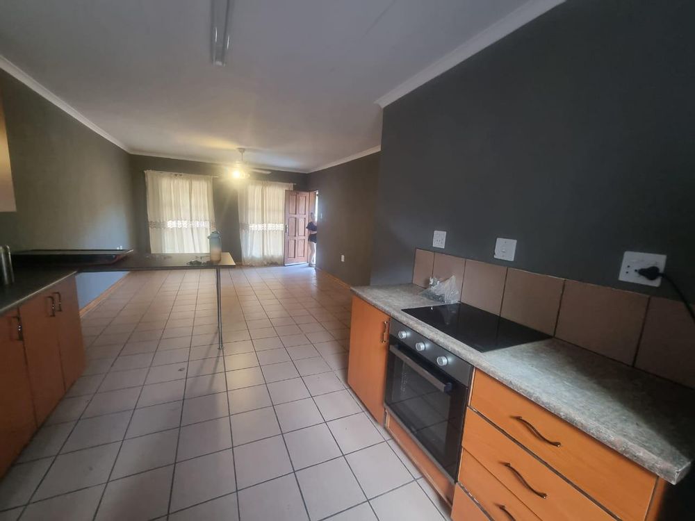 Kitchen with lounge at back