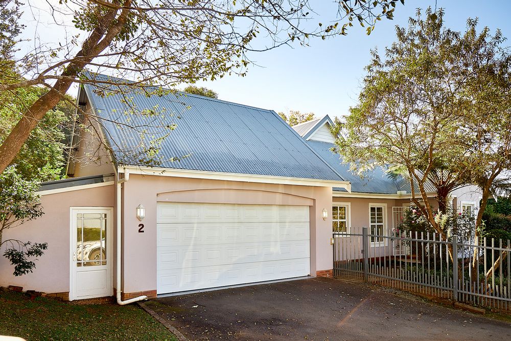 The double auto garage with the additional garden/storeage room on the left.