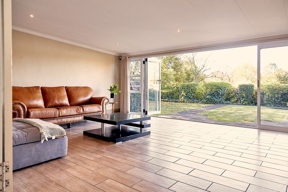 Off the open plan dining area - the very spacious enclosed veranda area - NE facing.