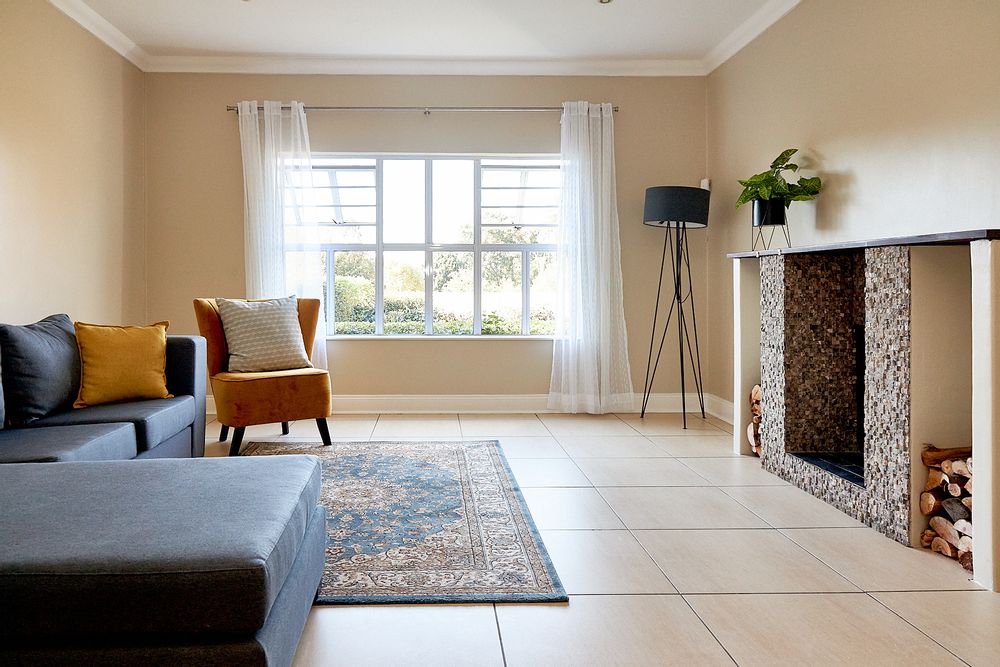 The formal lounge _ NE Facing and with an open fireplace.