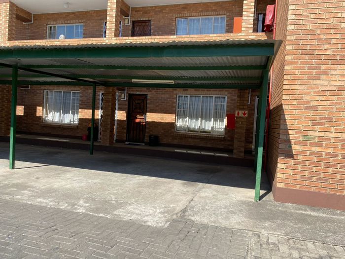 Rustenburg Central Flat For Sale: 2 Bedrooms, Rental Income Potential, Covered Parking.
