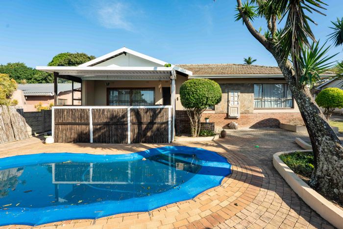 For Sale: House in Scottburgh South with pool, garden flat, and entertainment areas.