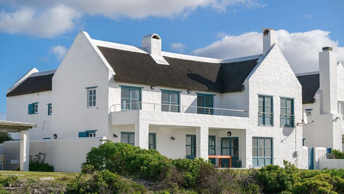 For Sale: Beachfront House in Struisbaai Central with sea views, guest cottage, and solar.