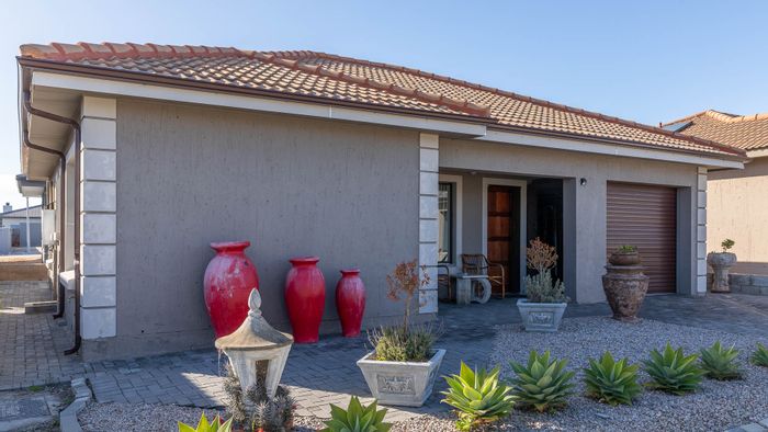 For Sale: 2-bedroom house in Dana Bay with en-suites, garage, and garden.