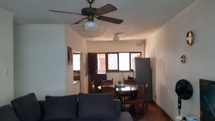 2-Bedroom Flat for Sale in Amanzimtoti, near shops and beachfront access.