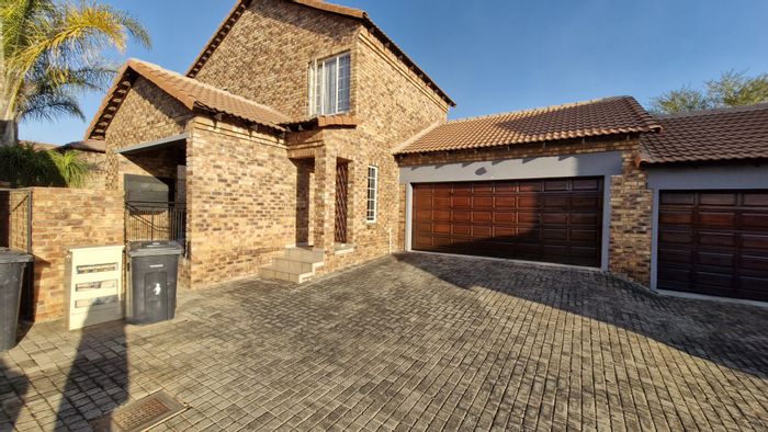 For Sale: Rooihuiskraal North Townhouse with 3 bedrooms, study, and garden.