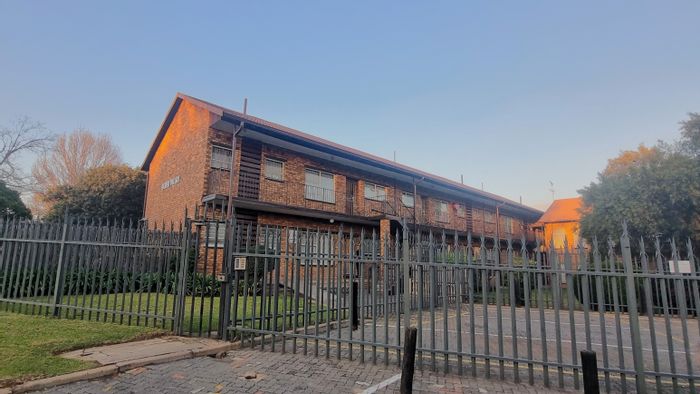 For Sale: 2-Bedroom Townhouse with 2 Garages in Secure Albemarle Complex.