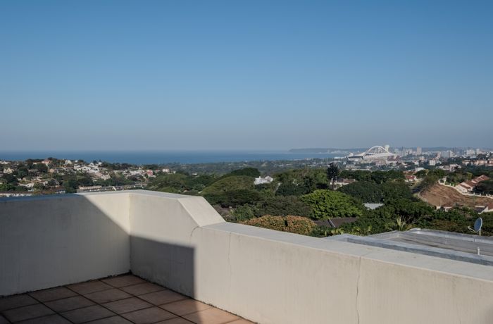 Umgeni Park Townhouse For Sale: 2-bed, sea views, private courtyard, secure complex.