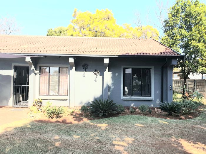 2-Bedroom House For Sale in Doornpoort with spacious yard and open-plan living.