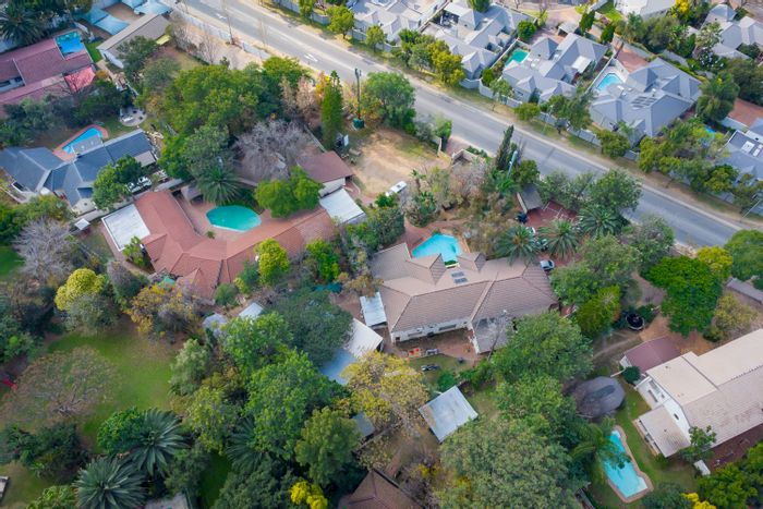 For Sale: Guest House in Magaliessig with dual stands, pools, and rental income.